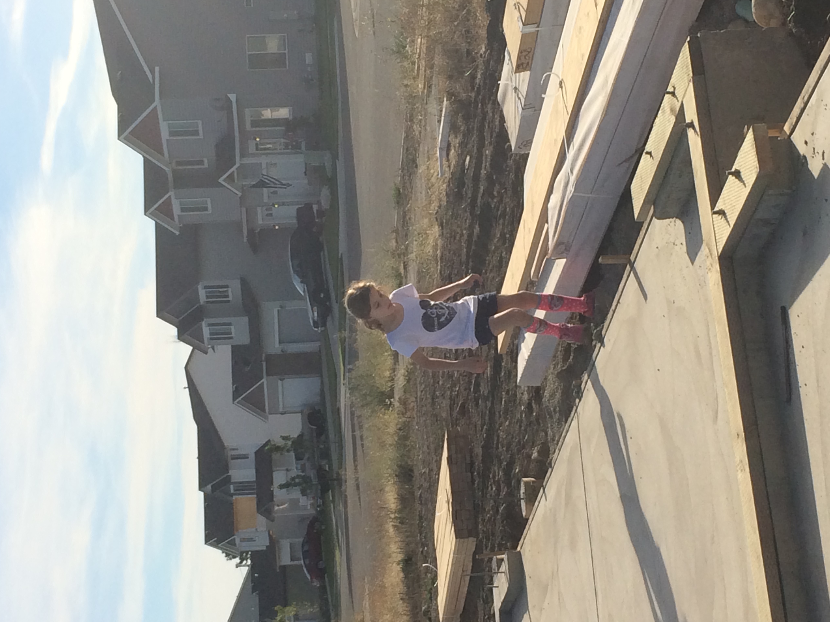 Eliza at our Post Falls home build — one of the many CdA-area moves we've lived through