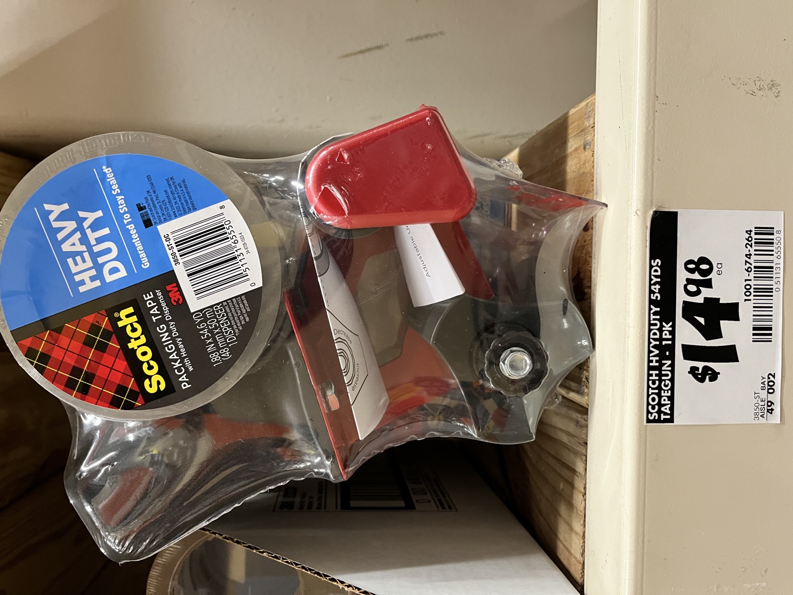 A roll of packing tape on the hardware store shelf, priced higher than most people guess